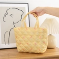 Close-up of yellow gingham quilted tote bag featuring delicate pink bow embroidery - Yellow Grid with Bow
