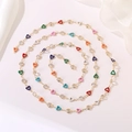 Detailed view of long gold chain necklace with colorful enamel hearts and sparkling crystals - Colorful Heart Enamel Chain (Style 22) / Length approx. 1m