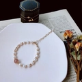 White freshwater pearl bracelet with a pink stone bead and adjustable gold chain - Single Strawberry Quartz Pearl Style