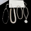 Dettaglio di braccialetti in argento con catena a serpente e perline con ciondolo tondo - Argento (Set da 4 pezzi)