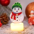 Christmas snowman LED night light with snowflake cutouts and warm glowing base - Snowman