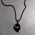Close-up of black metal ghost pendant necklace with a smiling face for Halloween - Necklace Set (With Pearl Chain) / Black