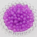 Close-up of translucent purple glass beads on a decorative glass tray for DIY jewelry - 4mm / Crystal Purple