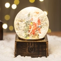 Luminous Christmas snow globe featuring Santa Claus and tree on a bronze base - Square Box Water Globe Santa with Tree