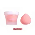 Peach pink beauty blender sponge in a frosted container with lid for seamless makeup - Peach Pink
