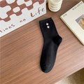 Black mid-calf cotton socks featuring white embroidered double hearts on dark wood - One Size / Black