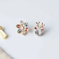 Macro detail of Christmas stud earrings featuring reindeer and snowflake with rhinestones - Snowflake Elk
