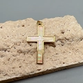 Macro shot of gold cross pendant with iridescent shell inlay on a textured stone base - Yellow (Cream Shell)