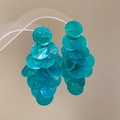 Detailed view of layered round turquoise shell tassel earrings with a glossy finish - Silver Earring Post U-shaped Rhinestone Style / Blue