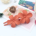 Double flower hair clip in matte orange finish with elegant resin petal structure - Orange Red