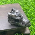Carved labradorite dragon head sculpture with natural gemstone flash and gray tones - Larvikite