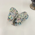 Detailed macro view of an elegant acetate butterfly hair claw clip with colorful patterns - Gemstone Graffiti Abstract Butterfly