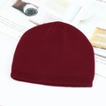 Winter knitted beanie in dark red wool blend with ribbed cuff on aesthetic backdrop - Burgundy