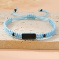 Detail of adjustable blue hand-woven rope bracelet with polished black center plate - Light Blue (Black Plate)