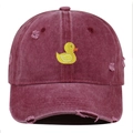 Detail of distressed embroidery featuring a yellow duck on a burgundy baseball cap - One Size / Burgundy