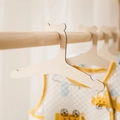 Wooden bear-shaped baby clothes hanger featuring natural wood grain for nursery decor - Bear / Natural Wood Color