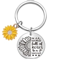 Detail of stainless steel keychain with yellow sunflower charm and engraved quote pendant - IN A WORLD full of ROSES be a SUNFLOWER
