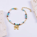 Bracciale a doppio strato dorato con perline colorate e ciondolo a fiocco metallico - Stile Fiocco