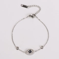 Macro shot of silver evil eye bracelet with sparkling cubic zirconia and metal chain - Steel