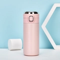 Pink stainless steel insulated travel mug with silver flip-top lid on white pedestal - 320ml / Smart Temperature Display / Pink