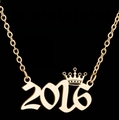 Golden crown number 2016 pendant necklace with fine chain on black background - 2016 / Gold