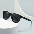 Classic black TR frame sunglasses with blue accents on a stylish geometric pedestal - Black Frame Blue Temple