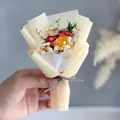 Detailed view of hand-held mini dried flower bouquet with roses and baby breath - Red Yellow Rose Mixed (Light Yellow Wrapping)