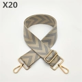 Close-up of wide woven bag strap with blue and white chevron pattern and gold metal hooks - Gray