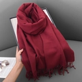 Elegant red knit scarf with soft cashmere-feel fabric and fringe detail on display - 68x180cm / Burgundy