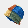 Close-up of multi-color patchwork knit beanie showing thick yarn texture and warm design - One Size / Yellow