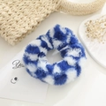 Detailed view of a soft plush blue and white checkered hair scrunchie for winter - Blue & White Checkerboard