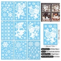 Set of 9 Christmas window clings featuring white snowflakes and gnomes in 20x30cm size - Santa Pulling Sleigh 9-Sheet Set