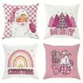 Set of 4 pink Christmas pillow covers featuring Santa, tree, and snowflake patterns - Pink Xmas Mix