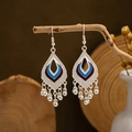 Detailed shot of ethnic silver hollow teardrop earrings with blue and red enamel tassels - Tear-drop Hollow Blue/Red Oil Drop Bead Tassel Style (E2871-21)