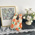 Cute knitted wrist bag with orange floral pattern on cream base and knot handle design - Orange Sakura