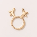 Close-up of golden reindeer antler Christmas ring with smooth metallic finish on beige backdrop - Gold Antler