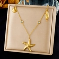 Detail of gold seashell starfish pendants with blue crystal beads on stainless steel chain - Multi-Ocean Elements With Light Blue Crystals (N3474)