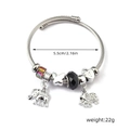 Detail view of elephant charm bracelet with 5.5cm diameter and silver braided wire cord - Double Elephant Butterfly Heart Lock (C1-014) / Black