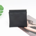 Close-up of black crocodile pattern faux leather pouch with automatic shrapnel closure - Solid Black