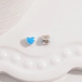 Macro view of blue enamel heart bead and hollow cylinder spacer in S925 sterling silver - Platinum Plated Blue Enamel Heart Bead