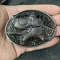 Close-up of a 3D T-Rex head belt buckle featuring a vintage gunmetal finish and metallic texture - Dinosaur