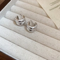 Macro shot of polished silver double-layered C-shaped earrings in a beige velvet jewelry box - Stainless Steel Pin - Silver C-Shape