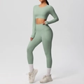 Detail of high-waist yoga leggings featuring a functional side pocket in sage green - S / Basil Green