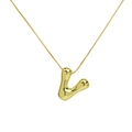 Macro detail of polished 18k gold plated letter V balloon pendant and box chain - Letter V