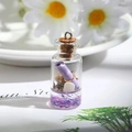 Detailed macro view of a miniature glass drift bottle charm with purple crystals and shells - Purple Drifting Bottle
