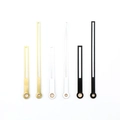 Three sets of minimalist metal clock hands in gold, silver, and black finish on white background - Black