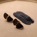 Brown ring size adjuster with gold crystal band rings on neutral background - Black (10 Pieces)