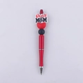Detail of red beaded ballpoint pen featuring Best MOM silicone tag and heart decoration - Band MOM
