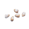 Macro shot of faceted teardrop charms with white and brown marble texture for DIY jewelry - Faceted Teardrop B50