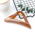 Elegant amber triangular hair claw clip with a glossy finish for a minimalist style - Glossy Yellowish Brown